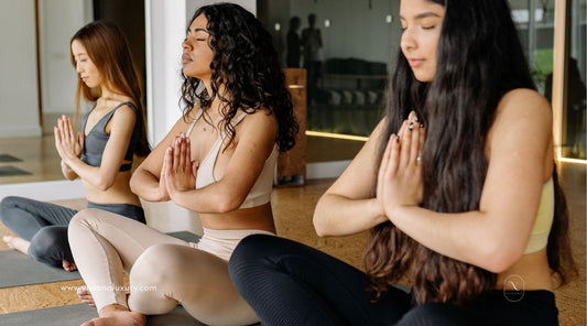 Women in class meditating