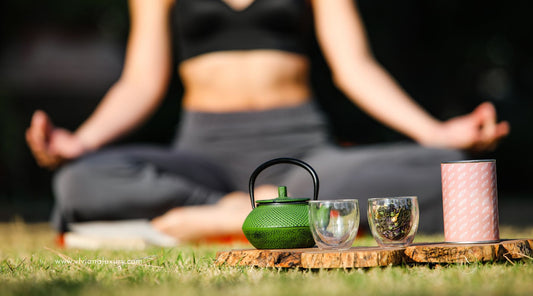 Woman Meditating & having Tea