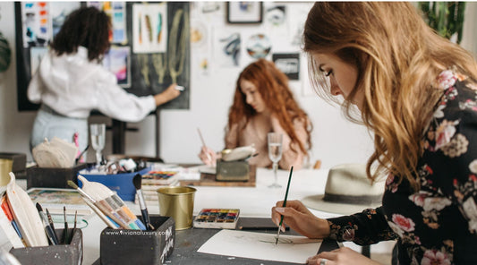 Women relaxing an a paint and sip art event